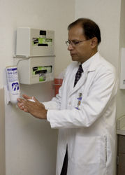 Rajiv Jain FACP chief of staff at the VA Pittsburgh Healthcare System and the Veterans Health Administration national MRSA program director demonstrates the proper use of hand sanitizer Photo by G